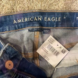 Ripped medium blue jeans
